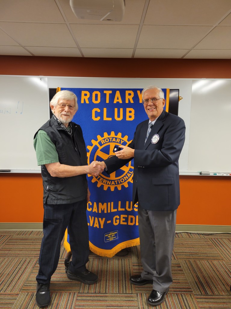 Club President John Rohner presented the Paul Harris plus 5 pin to club member Joe Gryga